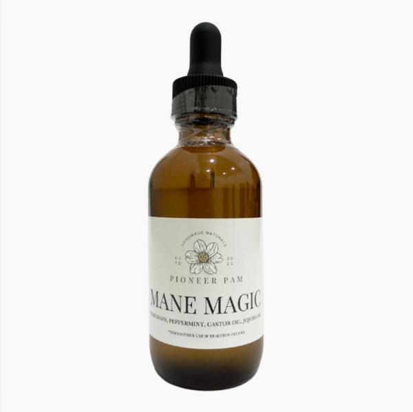 Pioneer Pam Mane Magic hair growth and scalp oil in a clear bottle with a dropper, designed for nourishing hair and scalp health.