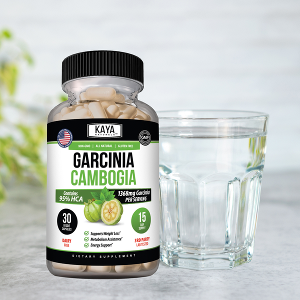 Bottle of Kaya Naturals Garcinia Cambogia supplement with orange and green label, showing capsules inside.