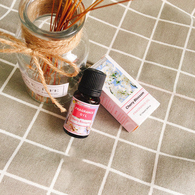 Bottle of FLIPSTYLEZLLC plant aromatherapy essential oil with natural botanical illustrations on the label.