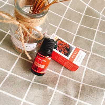 Bottle of FLIPSTYLEZLLC plant aromatherapy essential oil with a natural wooden cap, displayed on a neutral background.