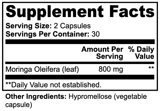 Vitalidad Natural Moringa Pure supplement container with green label and white lid, placed on a wooden surface.