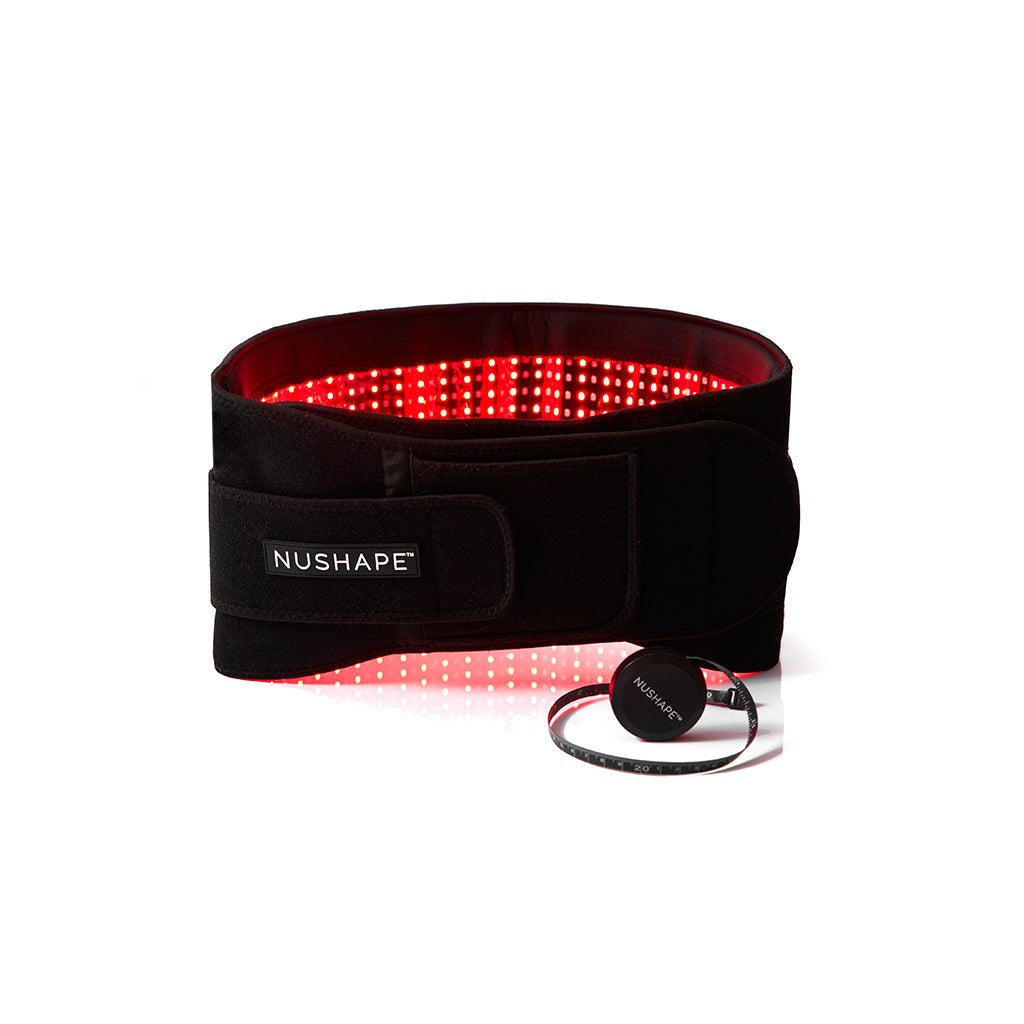 Nushape LipoWrap LED treatment device used for body slimming and skin tightening on a client’s abdomen.