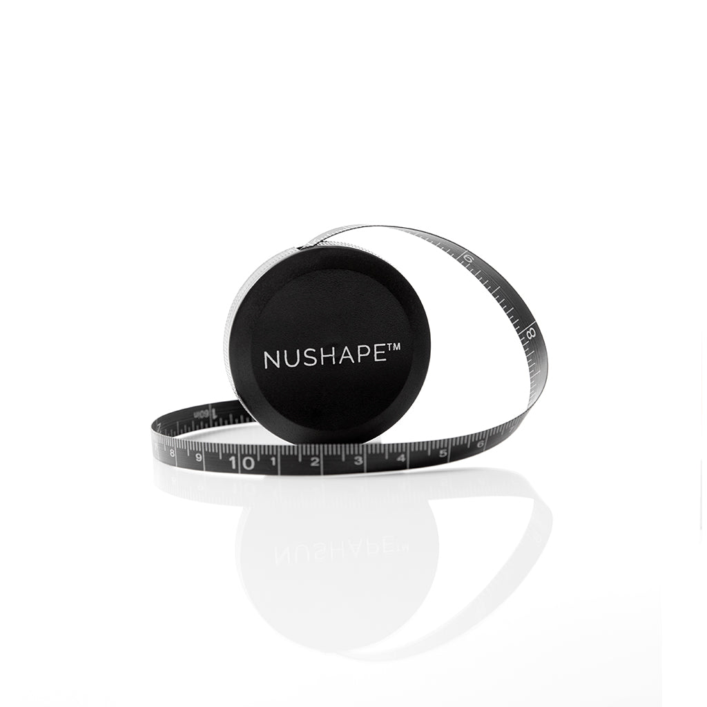 Nushape LipoWrap LED treatment device in use, showing the sleek black wrap around a person's abdomen for fat reduction therapy.