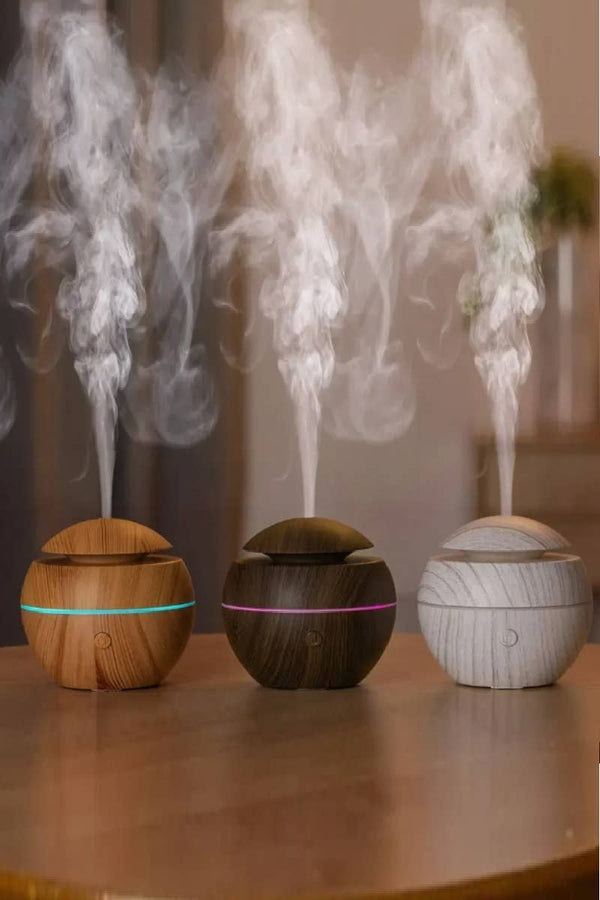 BioWizdom Tik Tok Ultrasonic Humidifier Aroma Therapy Diffuser showing a sleek white diffuser with mist output and control buttons.