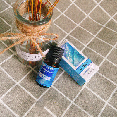 Bottle of FLIPSTYLEZLLC plant aromatherapy essential oil with a natural herbal scent, displayed in a clear glass container.