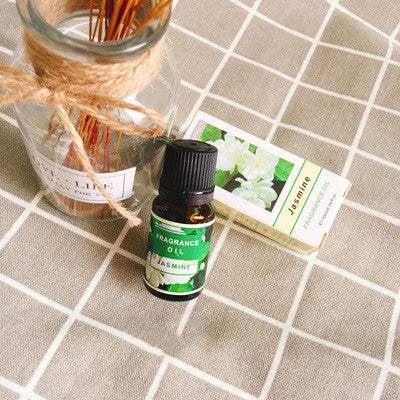 Bottle of FLIPSTYLEZLLC plant aromatherapy essential oil with a natural wooden cap and fresh botanical accents.