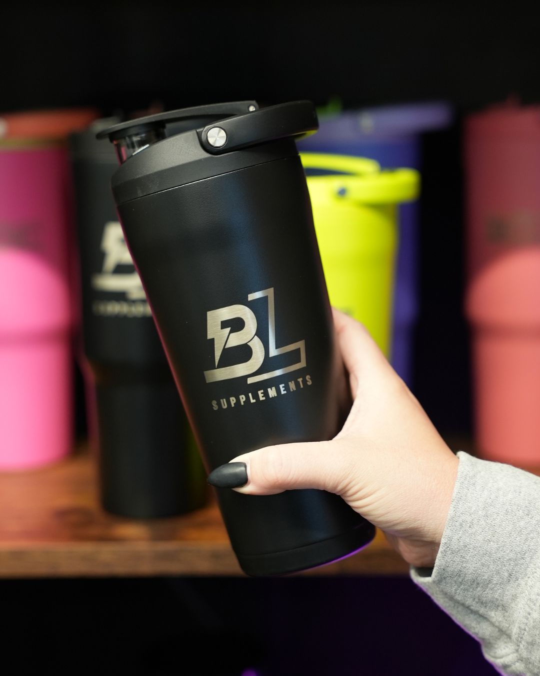 BlackLabel Supplements HydroJug 24 oz insulated shaker bottle with a sleek design and secure lid for hydration on the go.