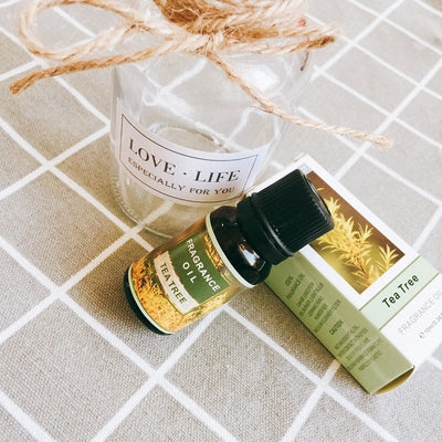 Bottle of FLIPSTYLEZLLC plant aromatherapy essential oil with plant illustrations on the label.