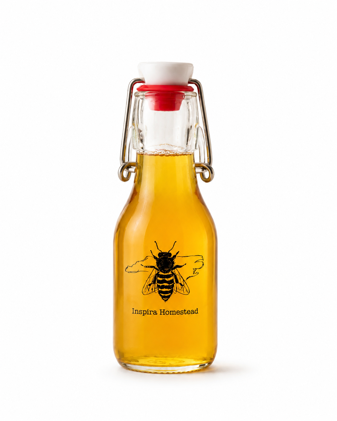 Jar of Inspira Homestead Sourwood Honey with a golden amber color and honeycomb in the background.