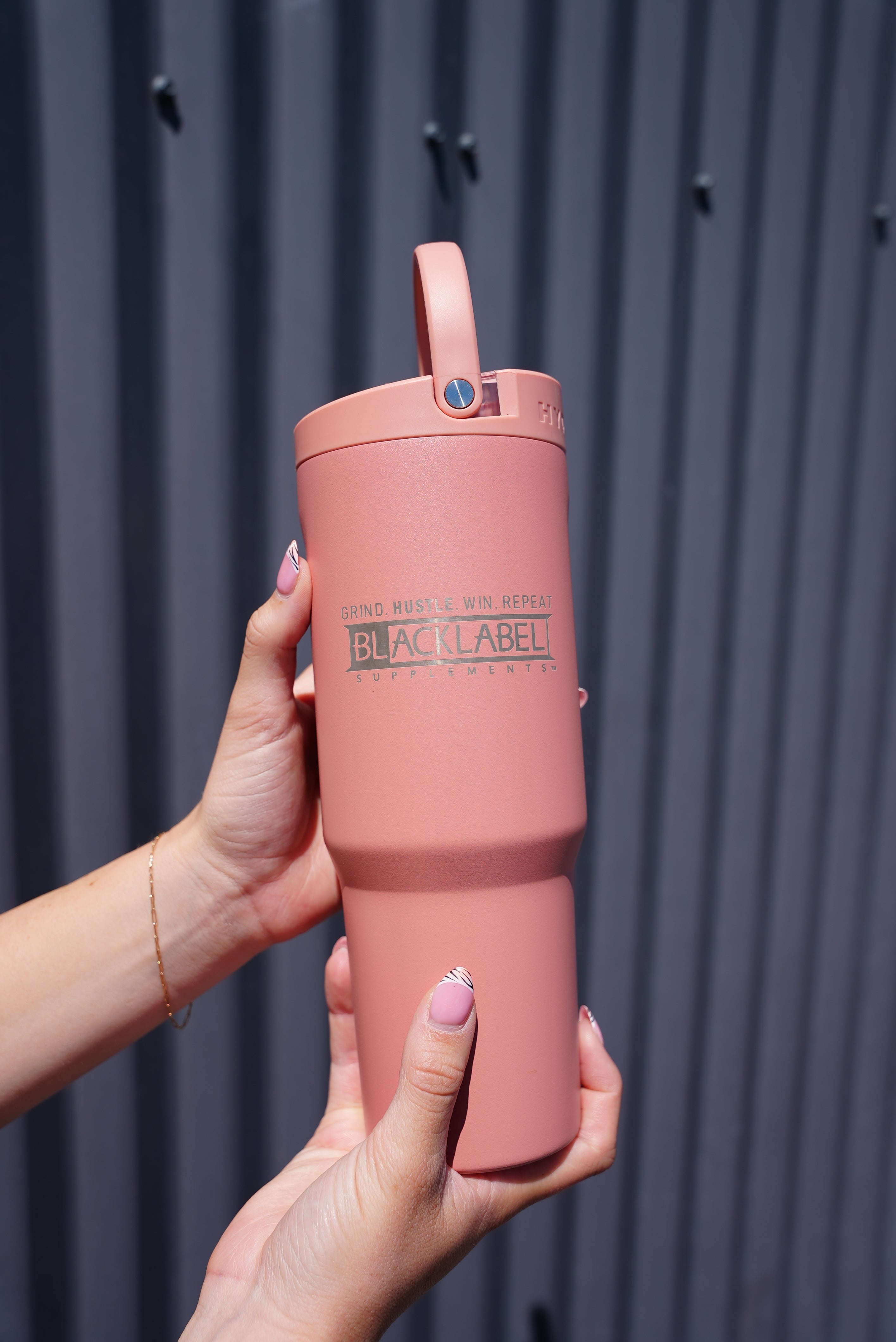 BlackLabel Supplements HydroJug 32 oz. sport cup with ergonomic handle and wide mouth for easy filling and cleaning.