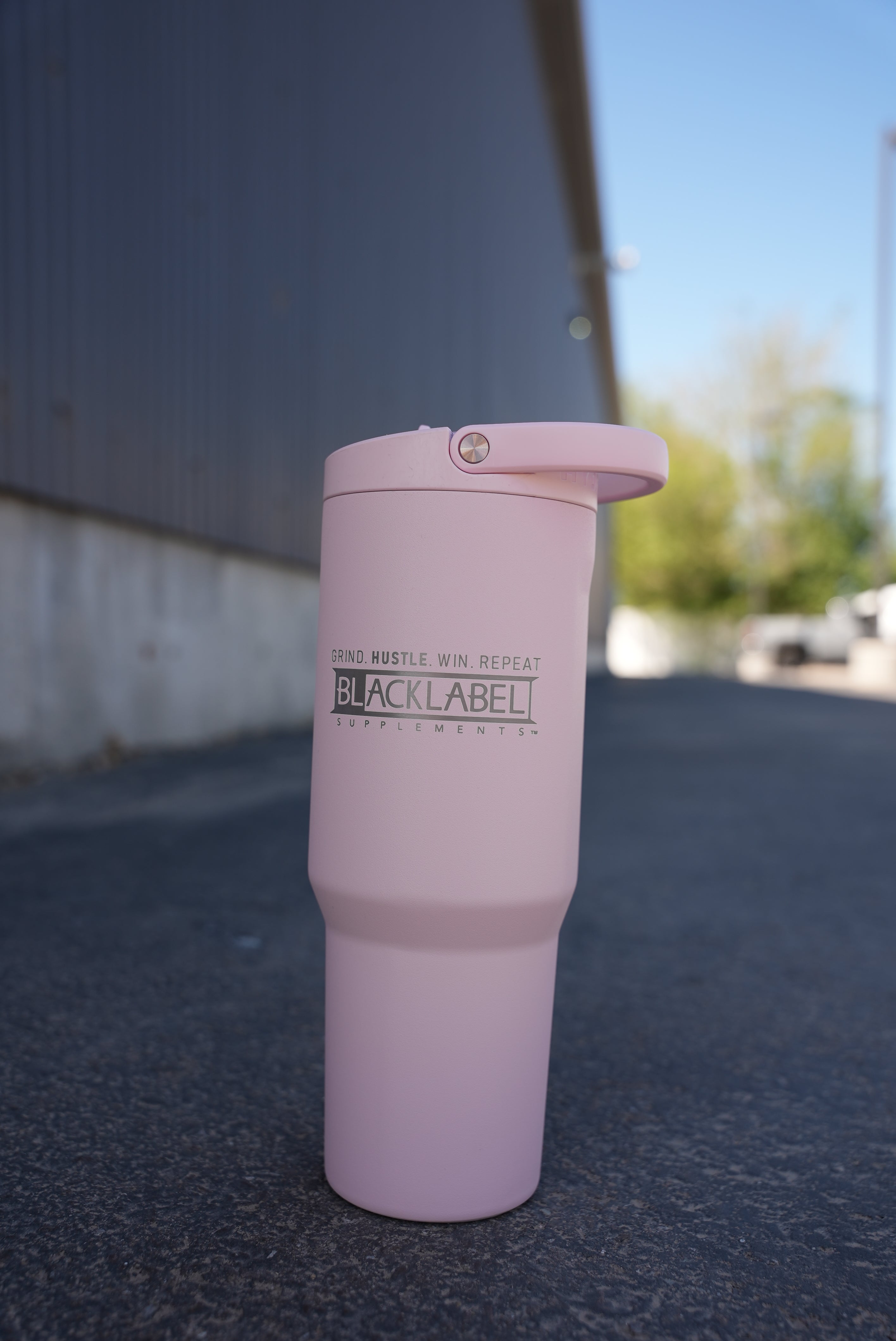 Hydrojug 32 oz. sport cup by BLACKLABEL Supplements, reusable water bottle with durable design and leak-proof lid.