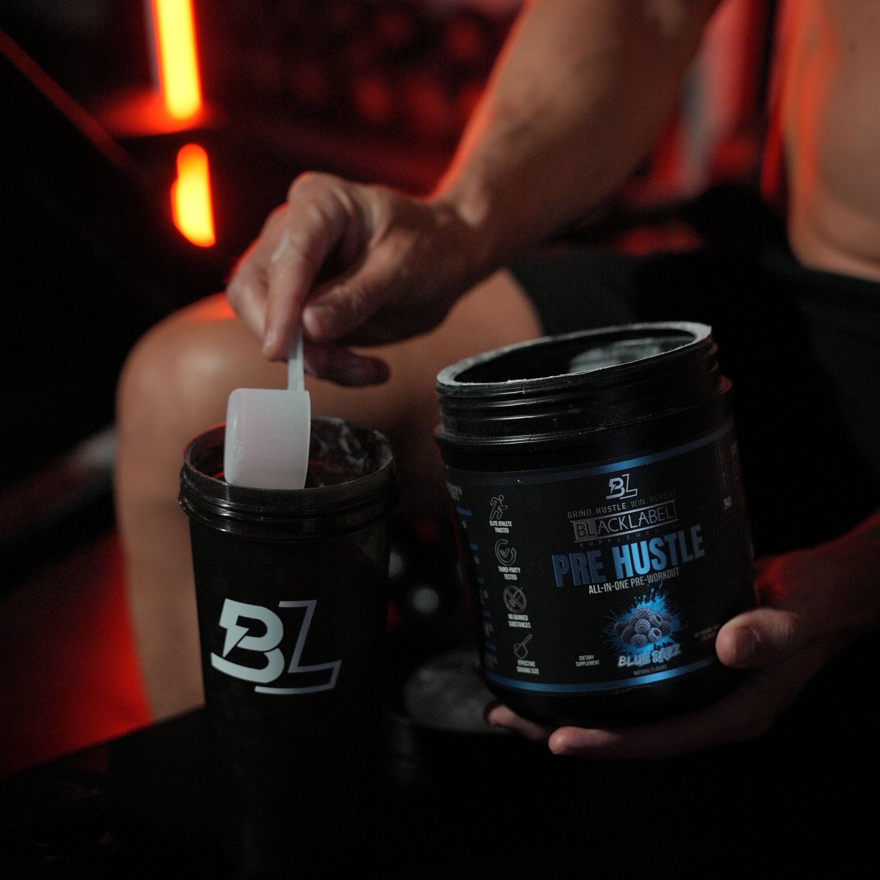 Blacklabel Supplements Pre Hustle V3 pre-workout powder in a container, ready for exercise enhancement.
