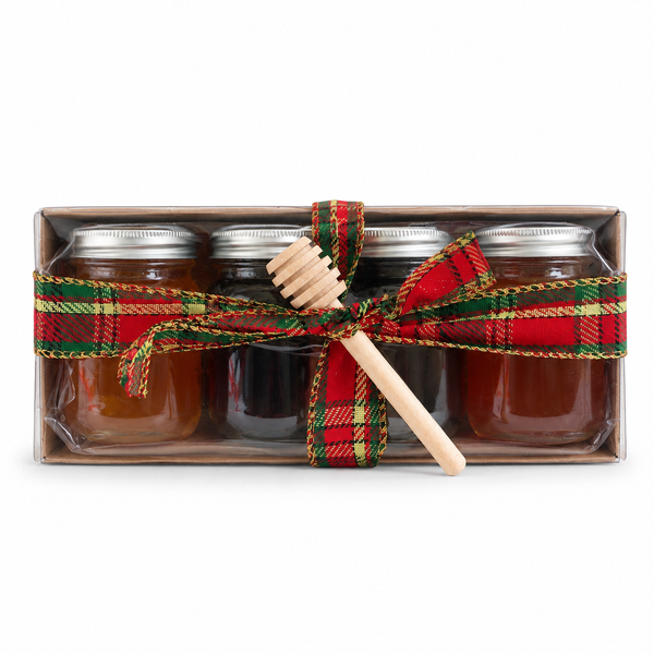 Assorted honey tasting flight with small jars of honey from Inspira Homestead on a wooden platter.
