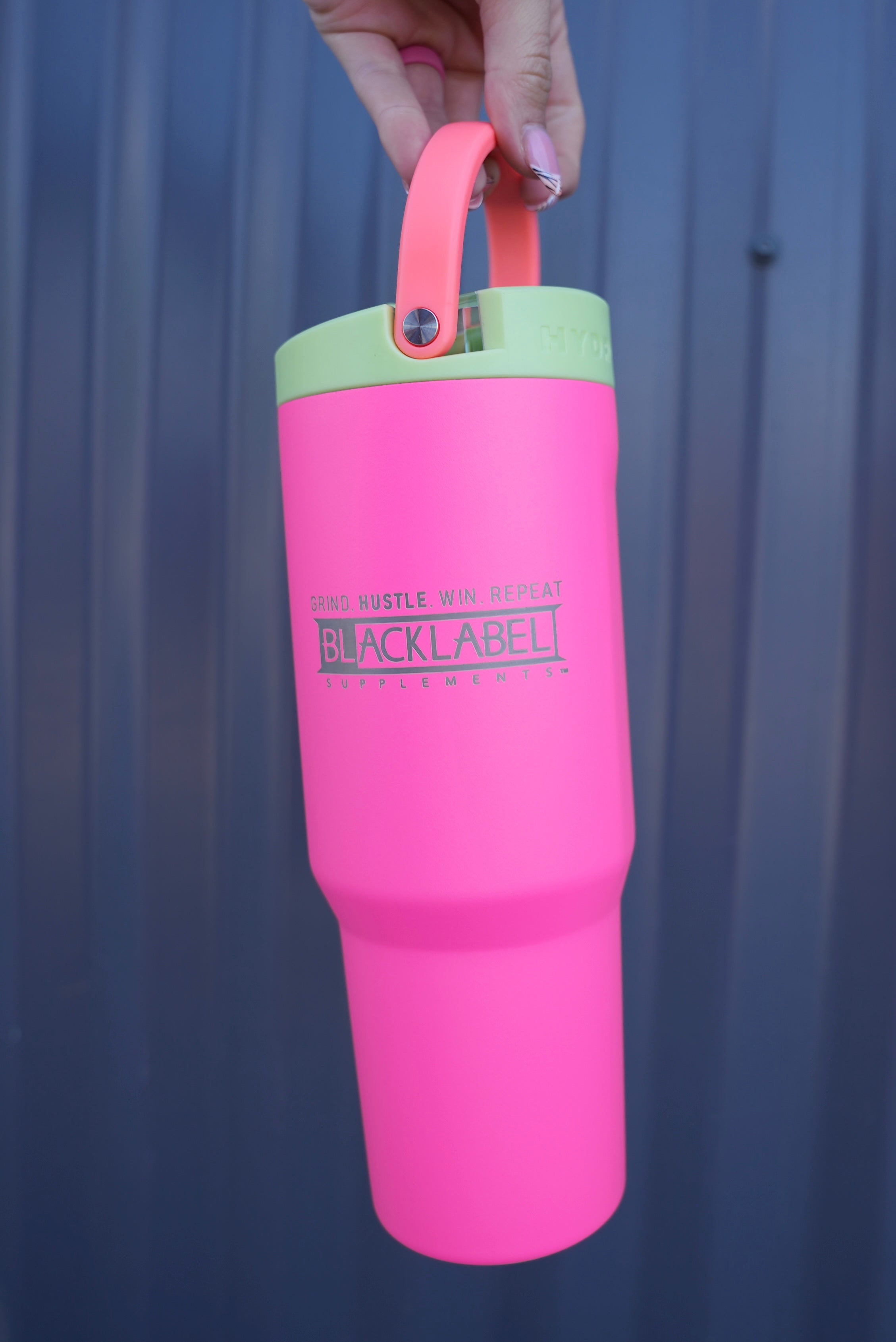 Blacklabel Supplements HydroJUG 32 oz. sport cup with a black lid and handle, designed for hydration during workouts.