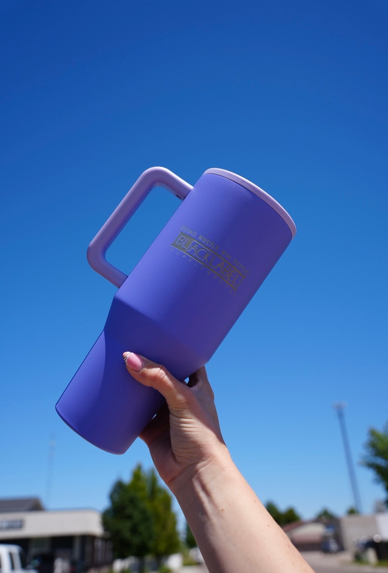 BlackLabel Supplements HydroJug 40 oz. traveler water bottle with a handle, designed for on-the-go hydration.