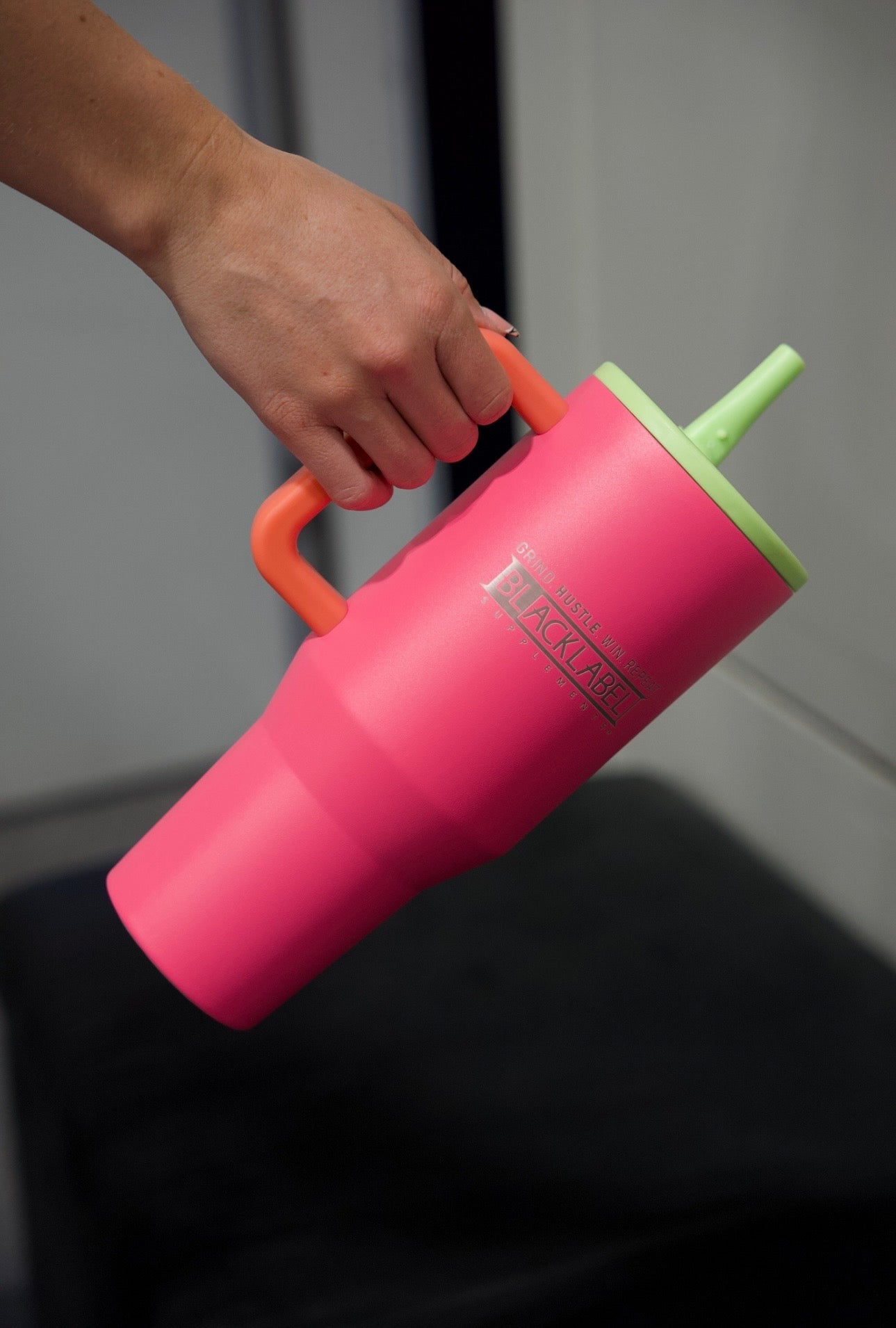 BlackLabel Supplements HydroJUG 40 oz. travel water bottle, durable plastic with ergonomic handle and screw-top lid.