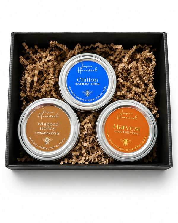 Inspira Homestead Southern Honey Gift Set with jars of golden honey, honey dipper, and gift box on a rustic background.