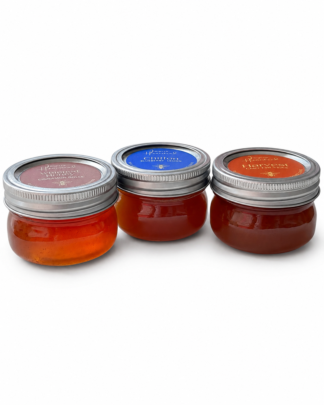 Side view of Inspira Homestead Southern Honey Gift Set featuring jars of honey and a rustic presentation.