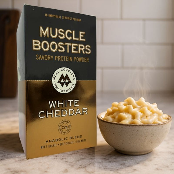 Organic grass-fed whey protein isolate muscle booster box with white cheddar flavor, includes 10 single-serve packs.