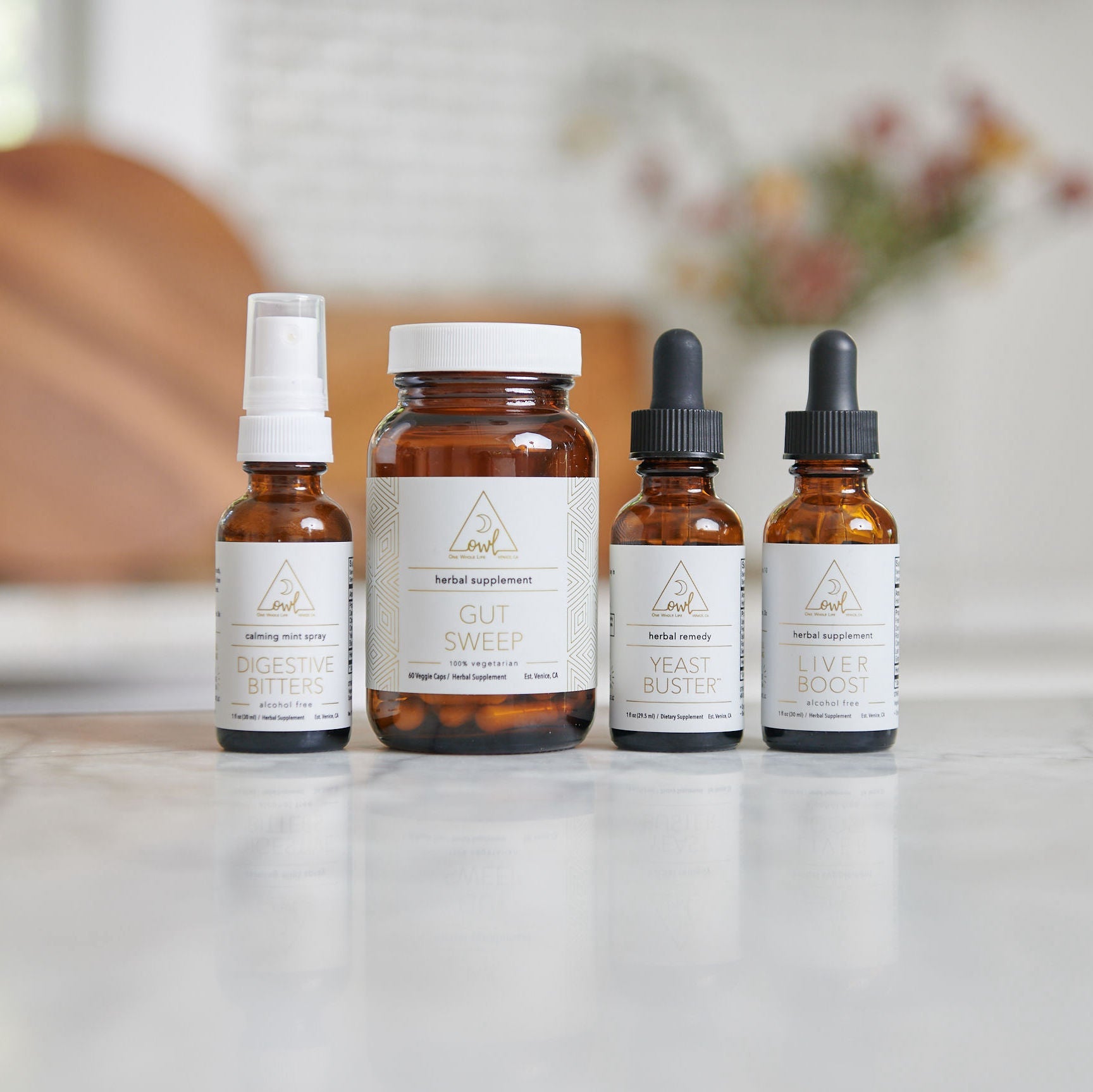 OWL Venice OWL Supplement Kit with bottles and packaging, containing various health supplements in a sleek, organized display.