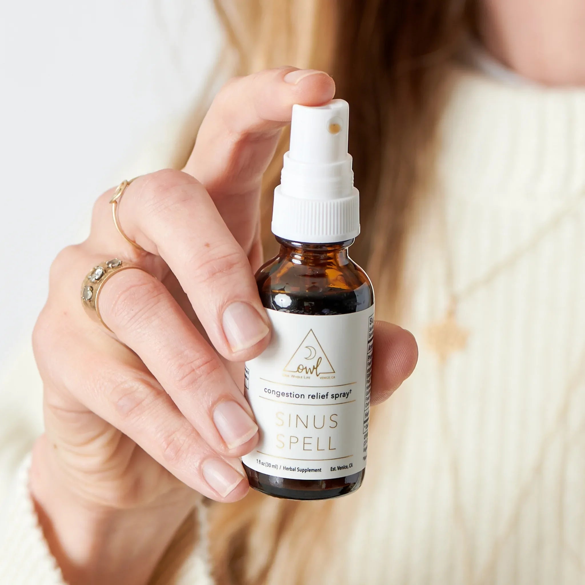 Bottle of OWL Venice Sinus Spell supplement with label visible, showcasing the nasal health support product.