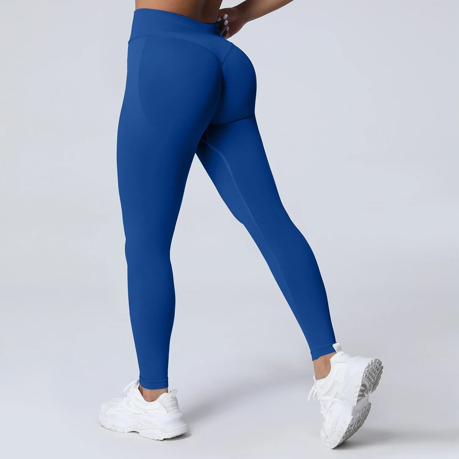 Women’s low waist scrunch bum yoga tights by THRIXINE, showcasing stretchy black leggings with a flattering scrunch detail at the back.