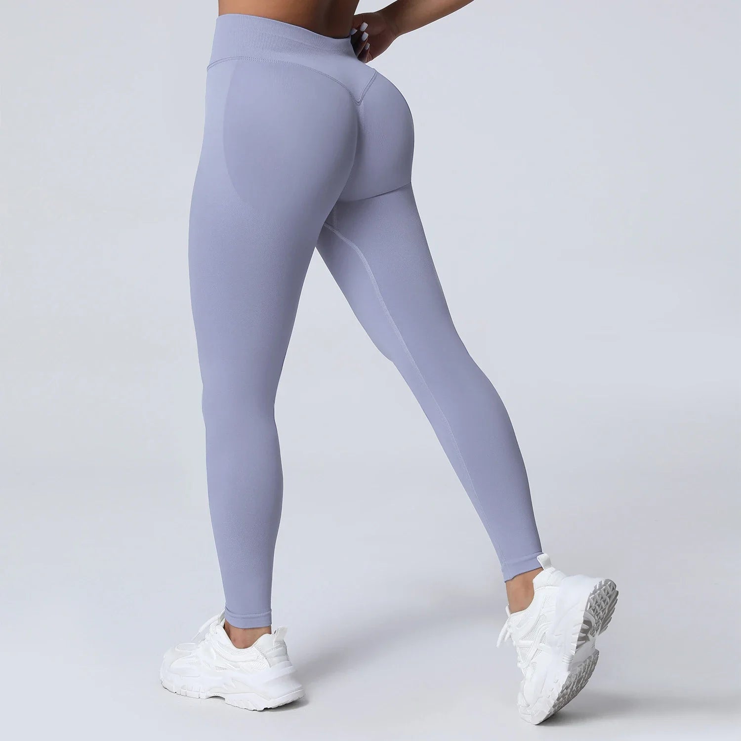 Women's low waist scrunch bum yoga leggings by THRIXINE, shown in black, with a close-up of the scrunch detail and stretchy fabric.