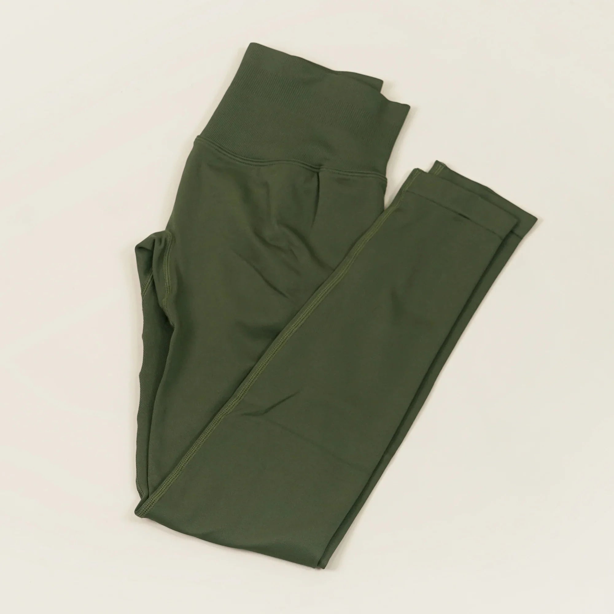 Women’s low waist scrunch bum yoga leggings by THRIXINE, showing the fitted black leggings with scrunch detail and flexible fabric.
