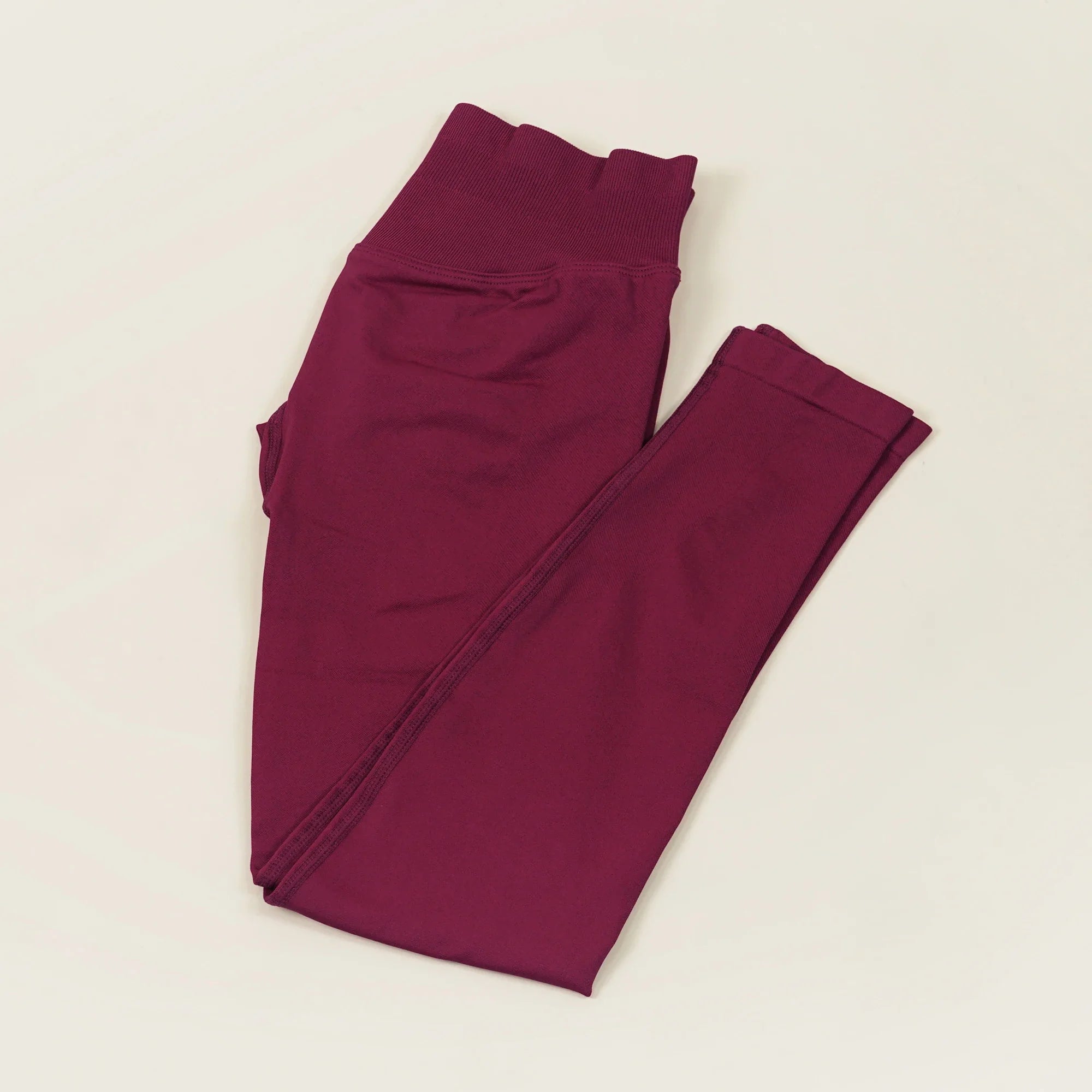 Women's low waist scrunch bum yoga leggings by THRIXINE, featuring a snug fit and comfortable stretch for active wear.