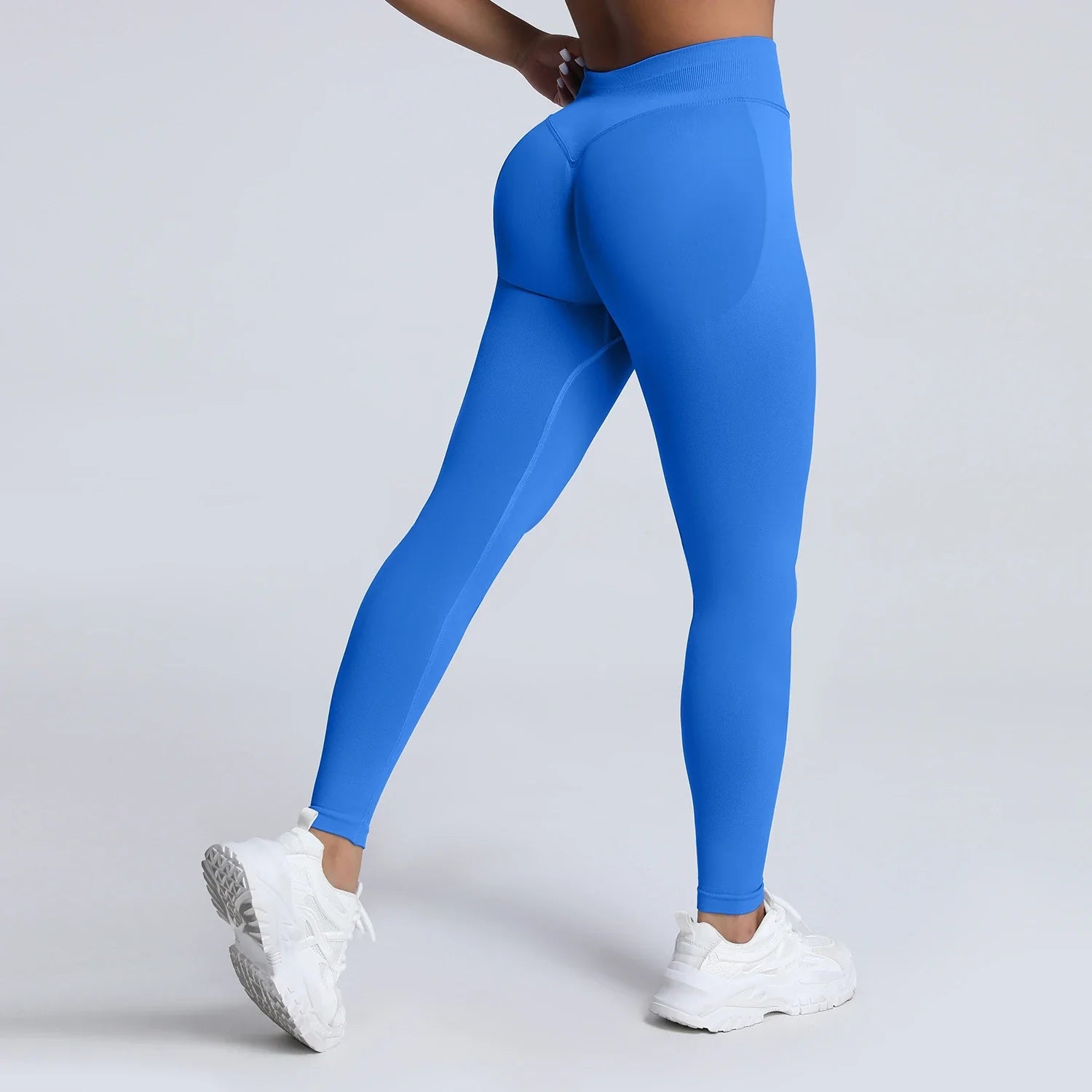 Women’s low waist scrunch bum yoga leggings by THRIXINE, showing fitted black leggings with a scrunch detail at the back.