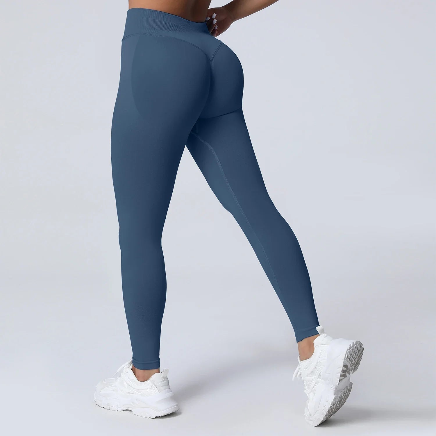 Women’s low waist scrunch bum yoga leggings by THRIXINE featuring a flexible fit and stylish design, shown on a model.