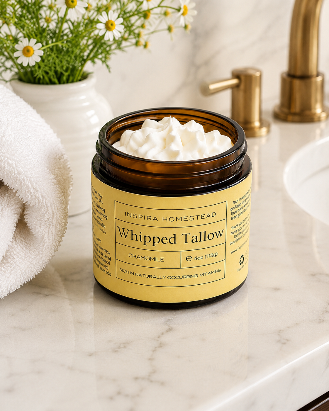 Creamy whipped grass-fed tallow from Inspira Homestead displayed in a jar, suitable for skincare or cooking applications.