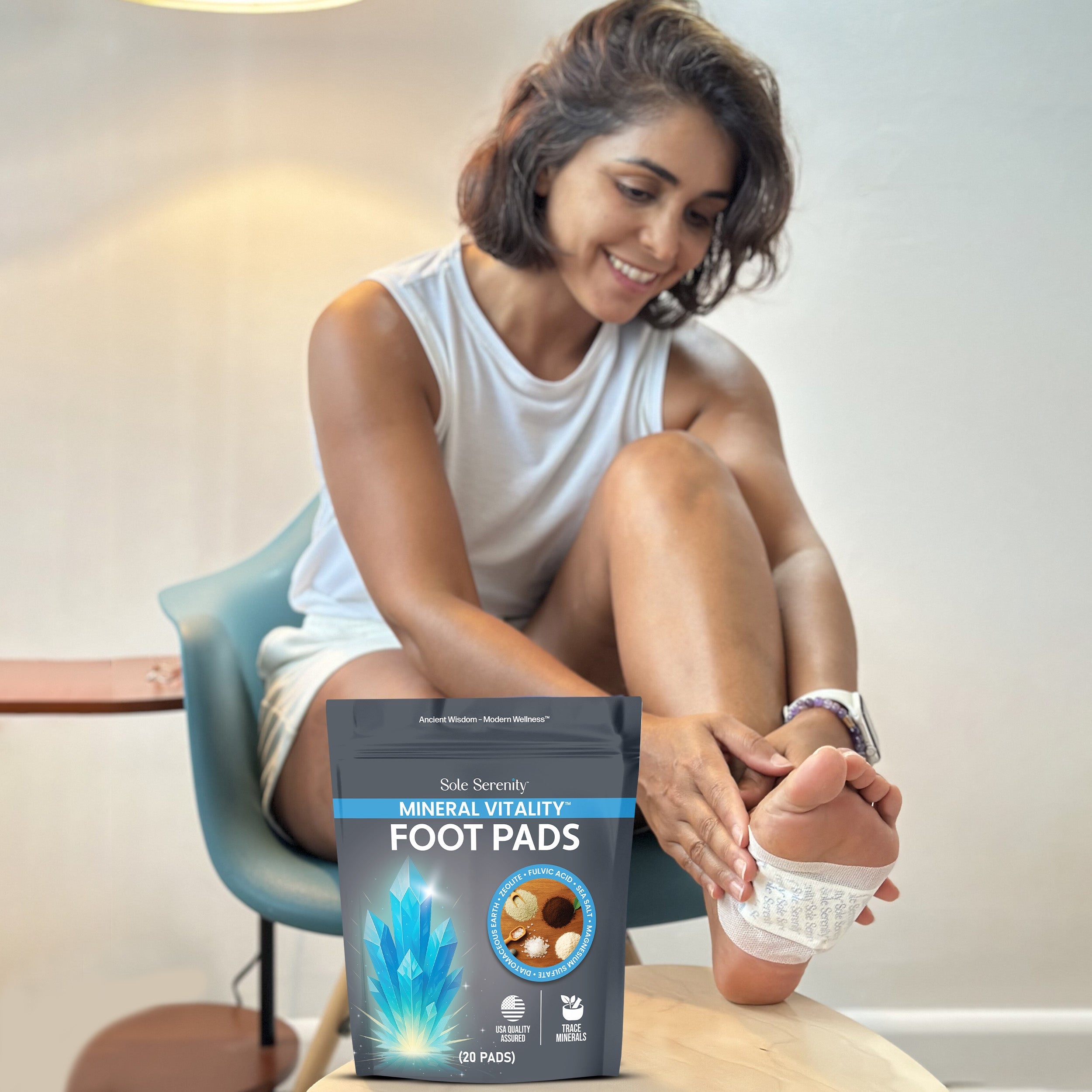 Lure Essentials Mineral Vitality Detox Foot Pads with Fulvic Acid, sea salt, and magnesium applied to the soles of clean feet.