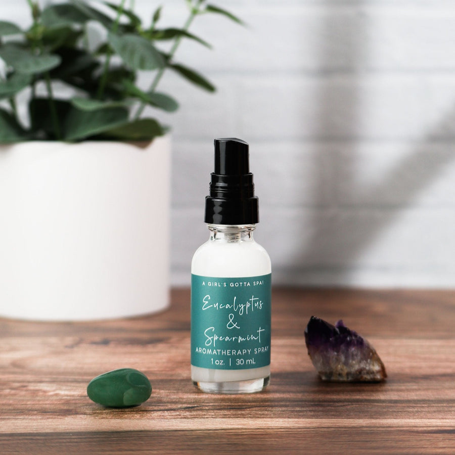 Eucalyptus and spearmint aromatherapy spray by A Girl's Gotta Spa! in a clear glass spray bottle, designed for relaxation and refreshment.