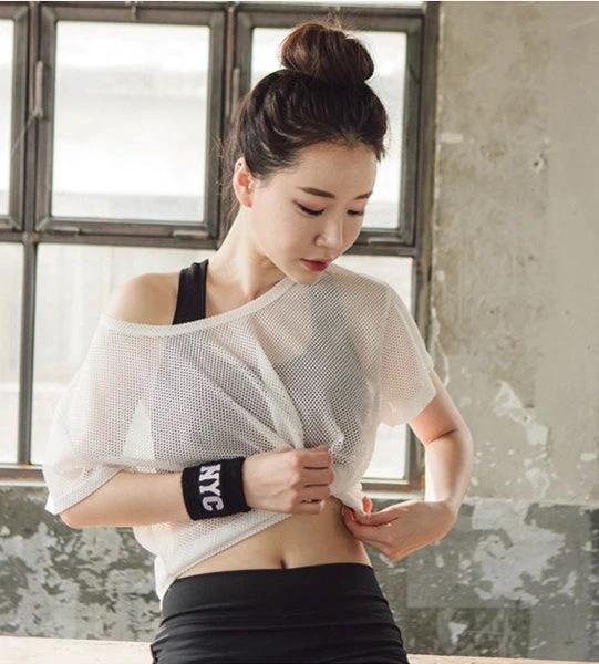Mandotos women's yoga shirt with hollow-out mesh design, crop top, breathable fitness top for running, gym, and active wear.