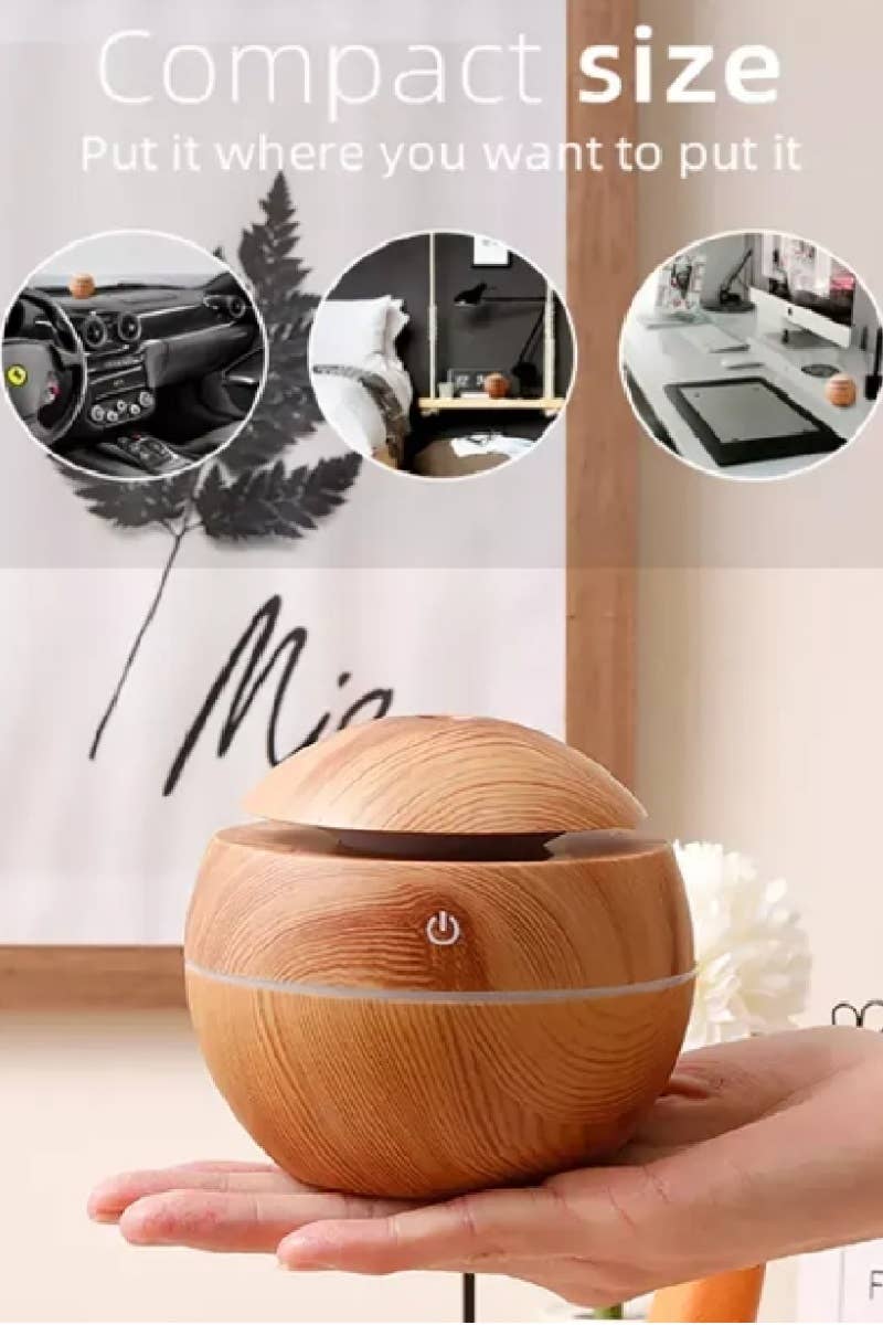BioWizdom Tik Tok Ultrasonic Humidifier and Aroma Therapy Diffuser emitting mist in a modern design.