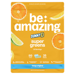 Be Amazing Super Greens powder with sunny D tangy flavor, showing the vibrant green supplement in a 25-serving container.