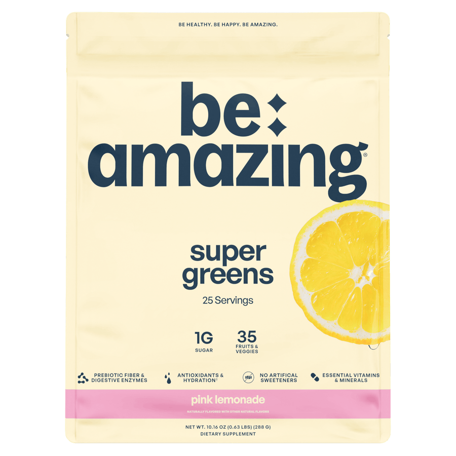 Be Amazing Super Greens powder in a jar, featuring vibrant green super greens blend for health and energy.