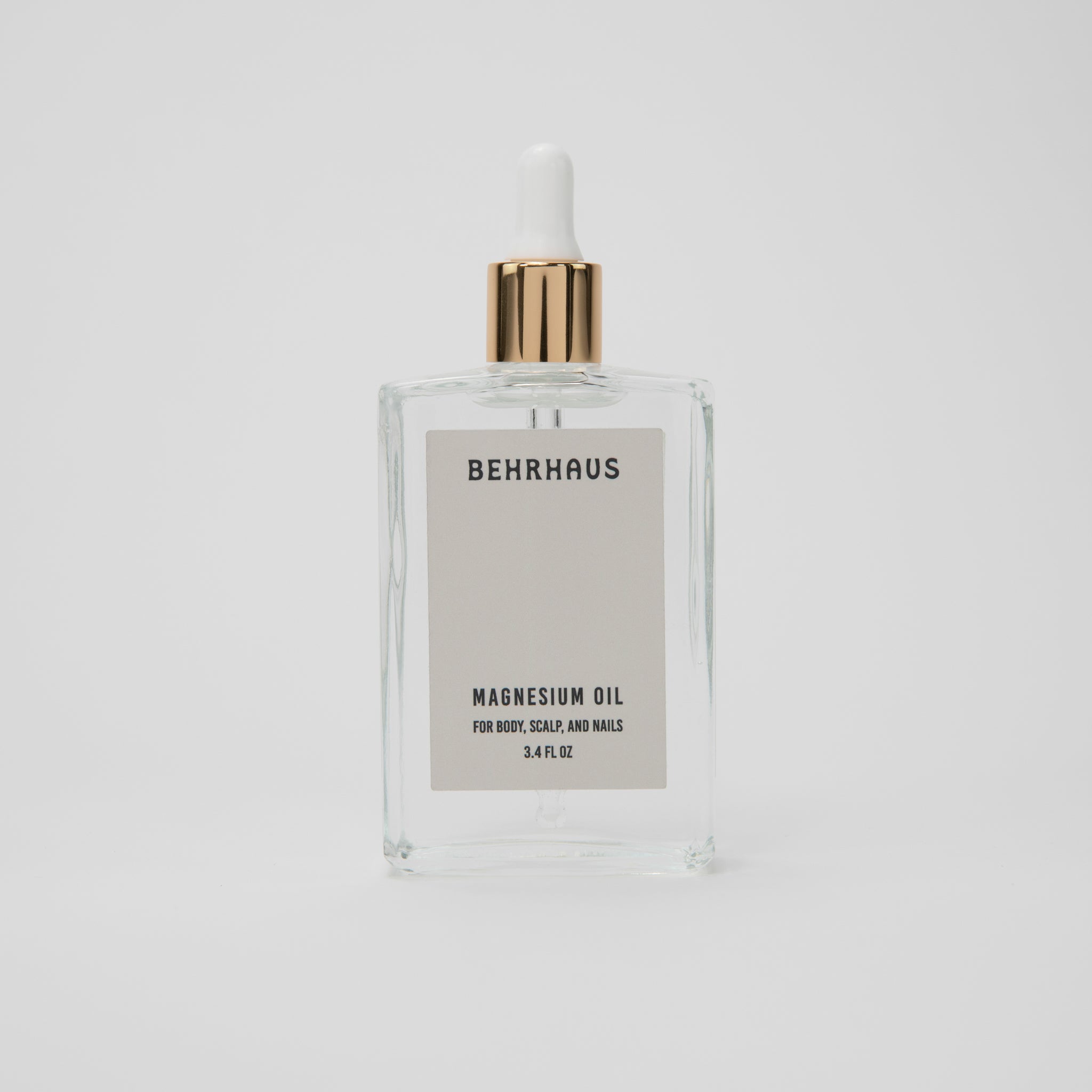 Behrhaus magnesium body oil in a 3.4 oz bottle, soothing skin with magnesium infusion for relaxation and muscle relief.