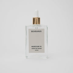 Behrhaus magnesium body oil in a 3.4 oz bottle, soothing skin with magnesium infusion for relaxation and muscle relief.