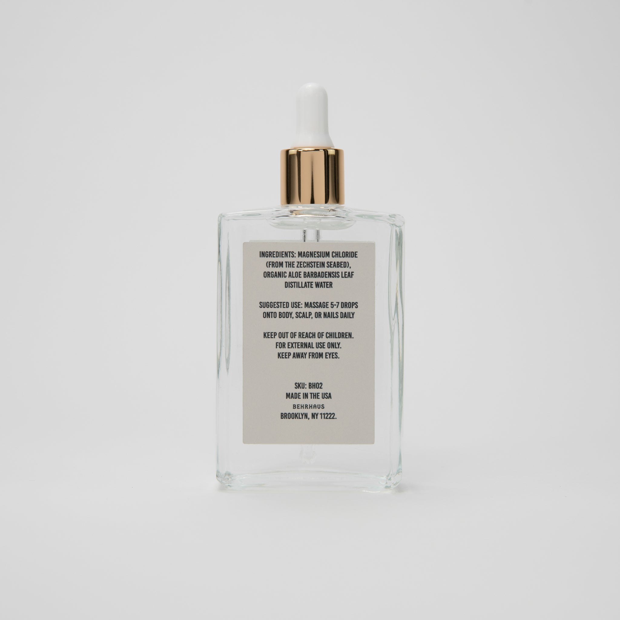 Behrhaus magnesium body oil in a 3.4 oz bottle, moisturizing and soothing skin with magnesium oil for relaxation and skin health.