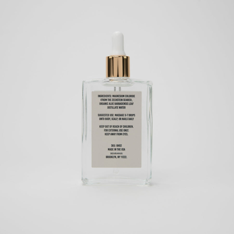 Behrhaus magnesium body oil in a 3.4 oz bottle, moisturizing and soothing skin with magnesium oil for relaxation and skin health.