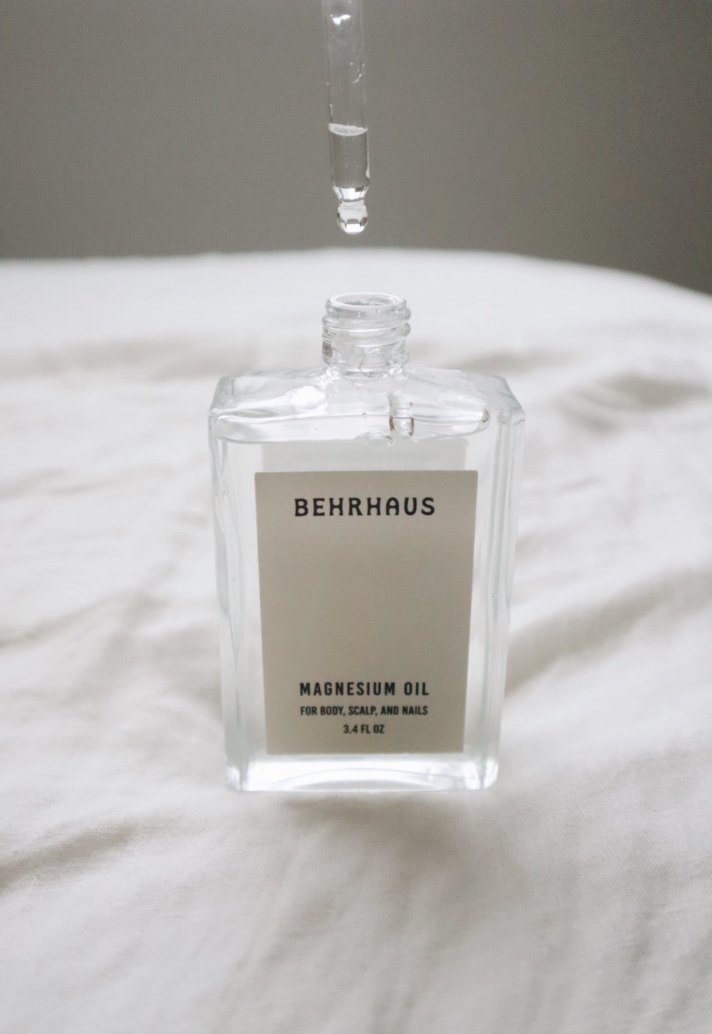 Behrhaus magnesium body oil in a 3.4 oz bottle, moisturizing body oil with magnesium for skin soothing and relaxation.