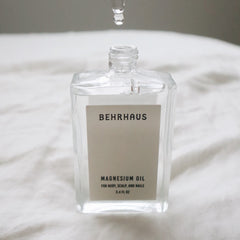 Behrhaus magnesium body oil in a 3.4 oz bottle, moisturizing body oil with magnesium for skin soothing and relaxation.