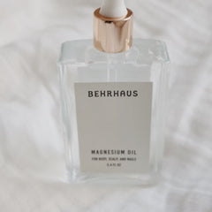 Behrhaus magnesium body oil in a 3.4 oz bottle, moisturizing and soothing skin with natural magnesium oil for relaxation and relief.