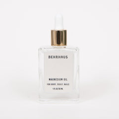 Behrhaus magnesium body oil in a 3.4 oz bottle, featuring clear liquid with a smooth, lightweight texture for skin absorption.