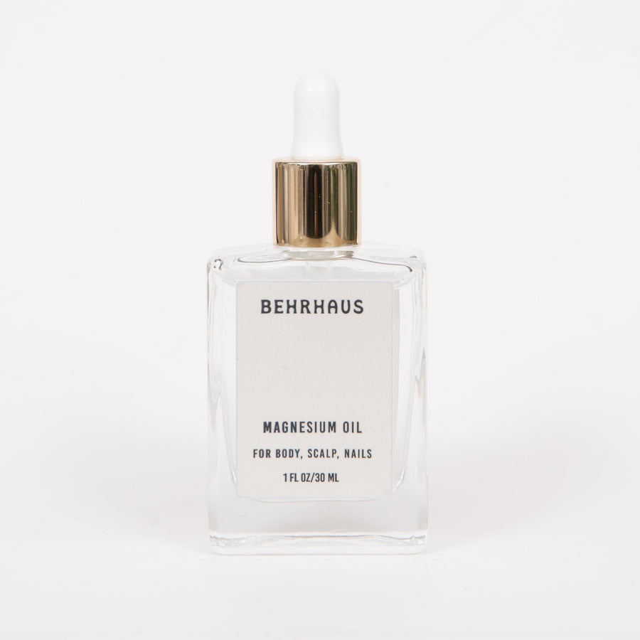 Behrhaus magnesium body oil in a 3.4 oz bottle, featuring clear liquid with a smooth, lightweight texture for skin absorption.