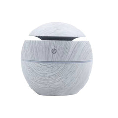 BioWizdom Tik Tok ultrasonic humidifier aroma therapy diffuser on marble surface, showing its compact design and mist outlet.