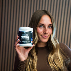 Container of BLACKLABEL Supplements creatine monohydrate powder with label visible in a clean, minimalist setting.