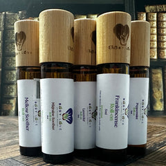 Body Love Self Care essential oil travelers roll-ons, portable diffuser oils in sleek bottles for on-the-go aromatherapy.